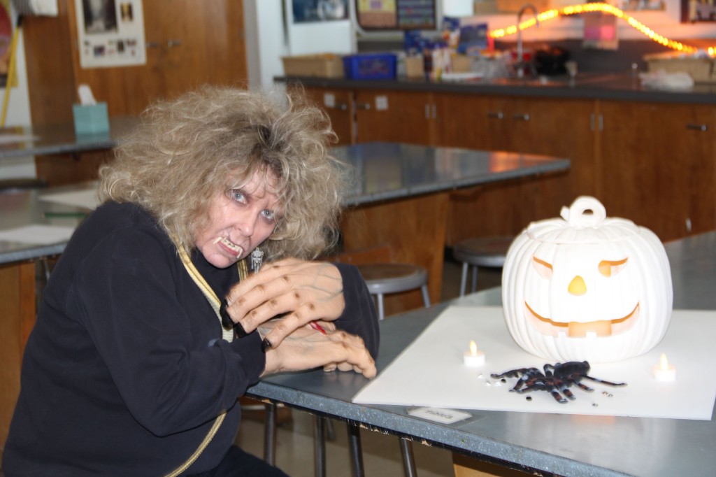 Art teacher Jill Stewart dressed up as a witch, complete with full makeup.