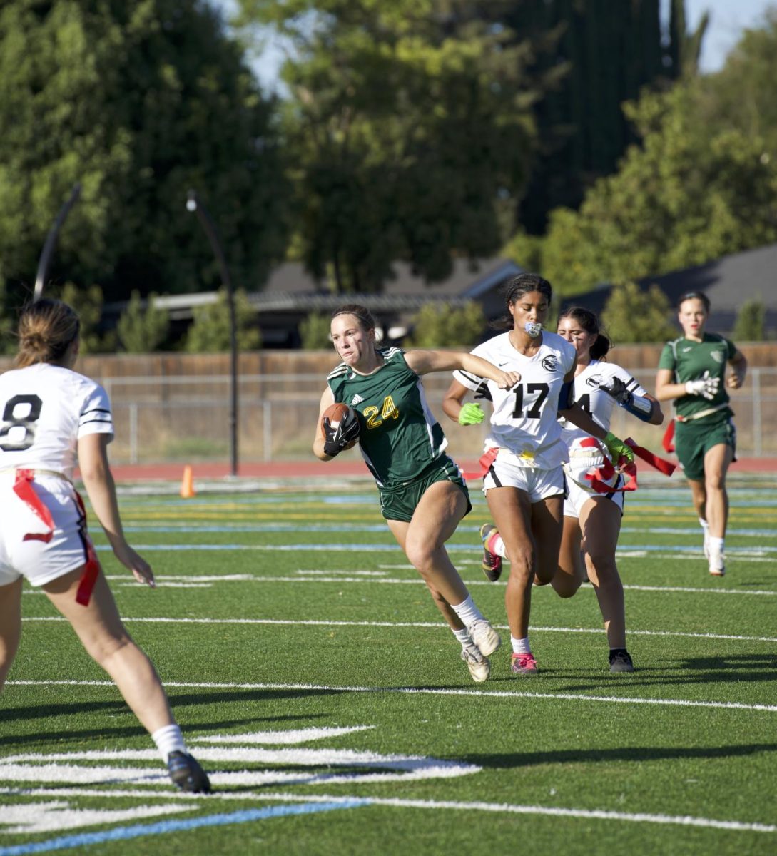 Caroline Siler (11) runs the ball. 