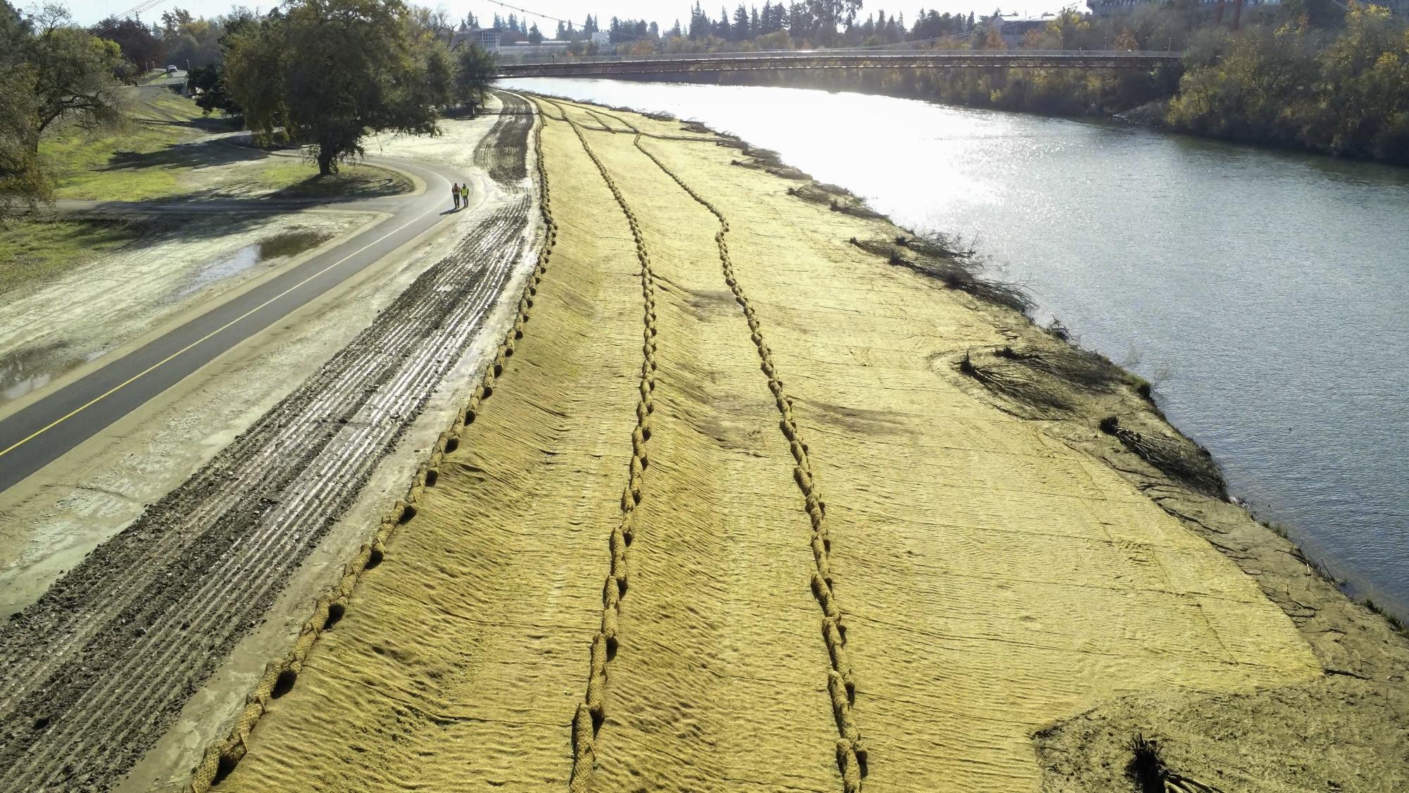 Construction on the American River levee near the Guy West Bridge at Sac State. Photo from the Army Corps of Engineers.