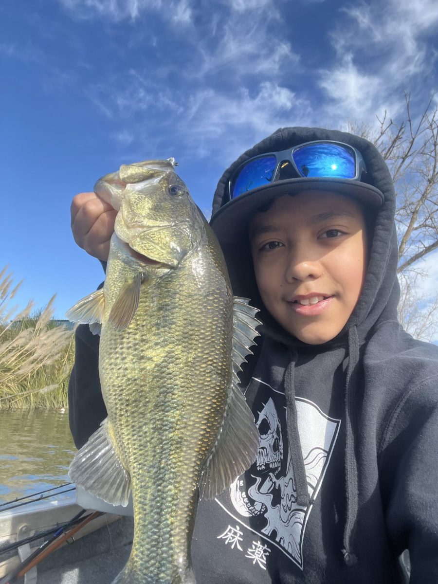 Freshman Lucas Sebastian shows off a fish he caught on the Sacramento River Delta (winter 2025).