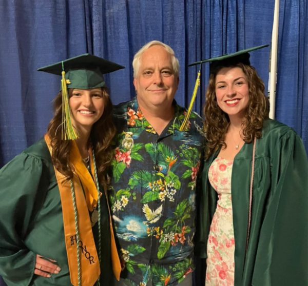 English Teacher Mathew Valencich, seen here at a graduation with Evelyn
Padilla (right) and an unidentified student, died suddenly over the summer