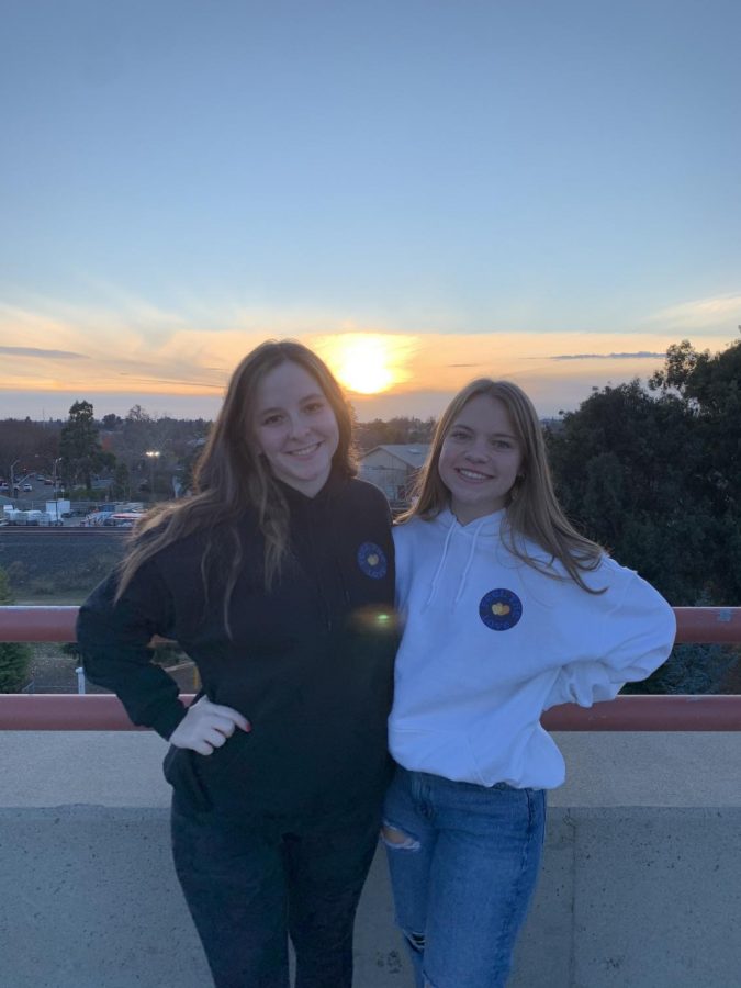 Lehrer and Halloran pose in their "Feel the Love" sweatshirts to promote their project. All of their merchandise was designed by Rio graduates Jane Snider and Chase Iseley.