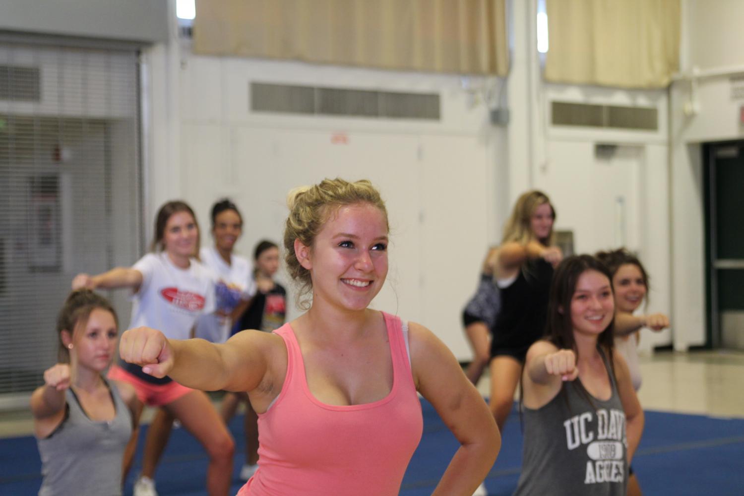 Dadigan leads a cheer practice Tuesday night.