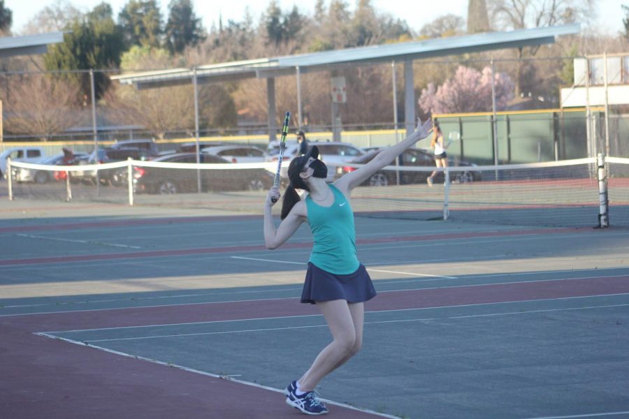 Senior Emma Chally works on her serve during practice at Rio early in the season. Chally was one of four graduating seniors playing on the team this year and will attend University of California in Santa Barbara in the fall.